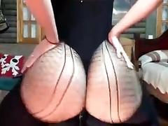 Gorgeous babe with a big, firm ass is about to ride a big, black dildo