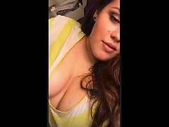 Voluptuous young brunette flaunts her hot cleavage and huge