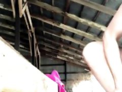 Naughty girl masturbates in barn