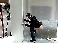 Girl sneaks into a construction site and pisses