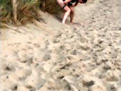 Nervous woman caught peeing in public at the beach
