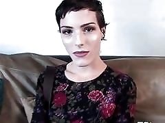 Cute short-haired TS jerks her big dick on casting couch